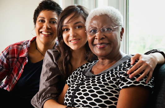 Women of different ages smiling together, representing women’s health, nutrition and healthy ageing through different stages of life.